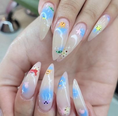 Beach-themed nail art photographed at Your Nail Salon